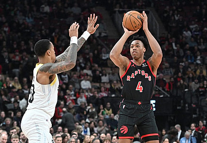 Dec 23, 2023; Toronto, Ontario, CAN;  Toronto Raptors forward Scottie Barnes (4) shoots the ball over Utah Jazz forward John Collins (20) in the first half at Scotiabank Arena. Mandatory Credit: Dan Hamilton-USA TODAY Sports