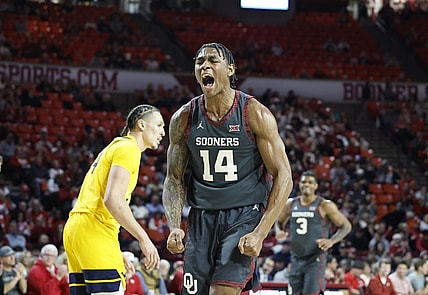 Jan 17, 2024; Norman, Oklahoma, USA; Oklahoma Sooners forward Jalon Moore (14) celebrates after scoring against the West Virginia Mountaineers during the second half at Lloyd Noble Center. Mandatory Credit: Alonzo Adams-USA TODAY Sports