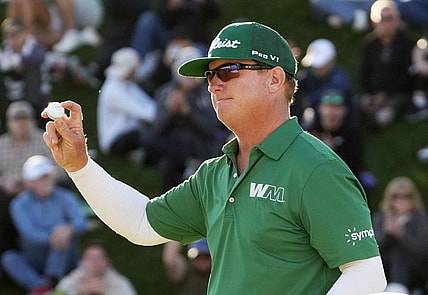 Feb 11, 2024; Scottsdale, AZ, USA; Charley Hoffman finishes with in the lead on the 18th hole during the final round of the WM Phoenix Open at TPC Scottsdale. Mandatory Credit: Rob Schumacher-Arizona Republic