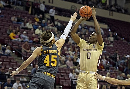 Feb 20, 2024; Tallahassee, Florida, USA; Florida State Seminoles guard Chandler Jackson (0) shoots the ball over Boston College Eagles guard Mason Madsen (45) during the first half at Donald L. Tucker Center. Mandatory Credit: Melina Myers-USA TODAY Sports