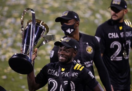 Dec 12, 2020; Columbus, Ohio, USA; Columbus Crew defender Jonathan Mensah (4) celebrates their 3-0 win over the Seattle Sounders in the MLS Cup at MAPFRE Stadium. Mandatory Credit: Joseph Maiorana-USA TODAY Sports