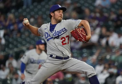 Apr 2, 2021; Denver, Colorado, USA; Los Angeles Dodgers starting pitcher Trevor Bauer (27) delivers a pitch in the second inning against the Colorado Rockies at Coors Field. Mandatory Credit: Ron Chenoy-USA TODAY Sports