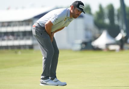 Jul 17, 2021; Sandwich, England, GBR; Louis Oosthuizen reacts to his putt on the first green during the third round of the Open Championship golf tournament. Mandatory Credit: Peter van den Berg-USA TODAY Sports
