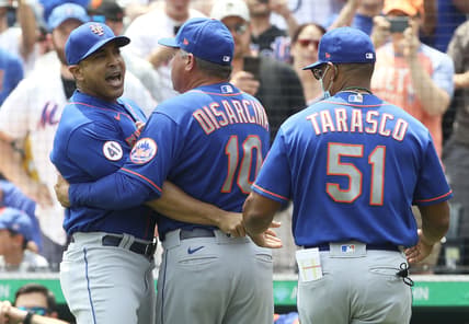 Jul 18, 2021; Pittsburgh, Pennsylvania, USA;  New York Mets manager Luis Rojas (left) reacts while being restrained by third base coach Gary Disarcina (10) and first base coach Tony Tarasco (51) after Rojas was ejected from the game against the Pittsburgh Pirates during the first inning at PNC Park. Mandatory Credit: Charles LeClaire-USA TODAY Sports
