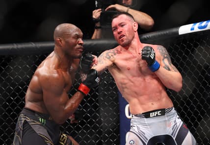 Nov 6, 2021; New York, NY, USA; Kamaru Usman (red gloves) competes against Colby Covington (blue gloves) during UFC 268 at Madison Square Garden. Mandatory Credit: Ed Mulholland-USA TODAY Sports
