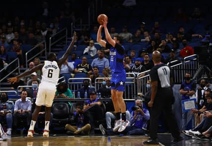 Mar 2, 2022; Orlando, Florida, USA; Orlando Magic forward Franz Wagner (22) shoots a three pointer over Indiana Pacers guard Lance Stephenson (6)  during the first quarter at Amway Center. Mandatory Credit: Kim Klement-USA TODAY Sports