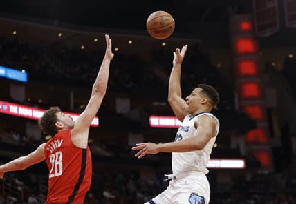 Mar 6, 2022; Houston, Texas, USA; Memphis Grizzlies guard Desmond Bane (22) shoots the ball over Houston Rockets center Alperen Sengun (28) during the second quarter at Toyota Center. Mandatory Credit: Troy Taormina-USA TODAY Sports