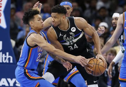 Mar 8, 2022; Oklahoma City, Oklahoma, USA; Oklahoma City Thunder guard Tre Mann (23) defends against Milwaukee Bucks forward Giannis Antetokounmpo (34) during the second quarter at Paycom Center. Mandatory Credit: Alonzo Adams-USA TODAY Sports