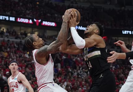 Apr 24, 2022; Chicago, Illinois, USA; Chicago Bulls forward DeMar DeRozan (11) and Milwaukee Bucks forward Giannis Antetokounmpo (34) go for the ball in the first half during game four of the first round for the 2022 NBA playoffs at United Center. Mandatory Credit: David Banks-USA TODAY Sports