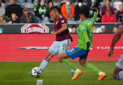 May 22, 2022; Commerce City, Colorado, USA; Colorado Rapids forward Diego Rubio (11) kicks the ball past Seattle Sounders defender Xavier Arreaga (3) in the second half at Dick's Sporting Goods Park. Mandatory Credit: Ron Chenoy-USA TODAY Sports