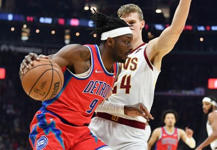 Mar 19, 2022; Cleveland, Ohio, USA; Detroit Pistons forward Jerami Grant (9) drives to the basket against Cleveland Cavaliers forward Lauri Markkanen (24) during the first quarter at Rocket Mortgage FieldHouse. Mandatory Credit: Ken Blaze-USA TODAY Sports