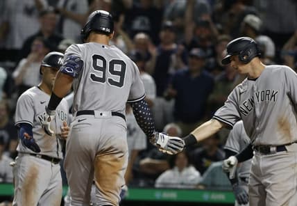 Jul 6, 2022; Pittsburgh, Pennsylvania, USA; New York Yankees shortstop Isiah Kiner-Falefa (left) and first  baseman DJ LeMahieu (right) congratulate center fielder Aaron Judge (99) after hitting a grand slam home run against the Pittsburgh Pirates during the eighth inning at PNC Park. Mandatory Credit: Charles LeClaire-USA TODAY Sports