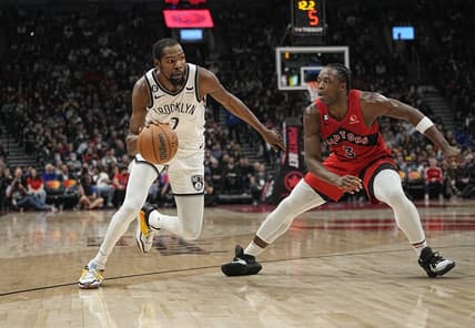 Nov 23, 2022; Toronto, Ontario, CAN; Brooklyn Nets forward Kevin Durant (7) drives to the net against Toronto Raptors forward O.G. Anunoby (3) during the second quarter at Scotiabank Arena. Mandatory Credit: John E. Sokolowski-USA TODAY Sports