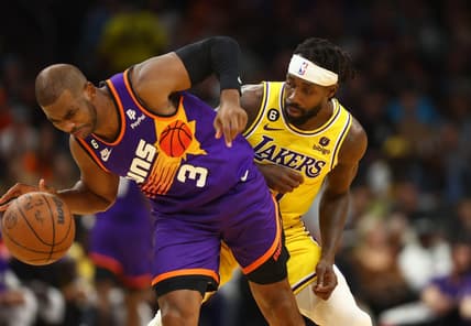 Dec 19, 2022; Phoenix, Arizona, USA; Phoenix Suns guard Chris Paul (3) is fouled by Los Angeles Lakers guard Patrick Beverley in the first half at Footprint Center. Mandatory Credit: Mark J. Rebilas-USA TODAY Sports