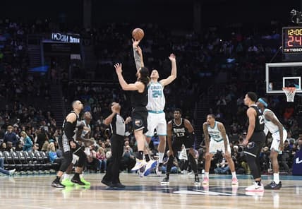 Jan 4, 2023; Charlotte, North Carolina, USA; Memphis Grizzlies center Steven Adams (4) and Charlotte Hornets center Mason Plumlee (24) tip off the game at the Spectrum Center. Mandatory Credit: Sam Sharpe-USA TODAY Sports