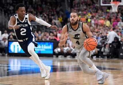 Jan 25, 2023; Providence, Rhode Island, USA; Providence Friars guard Jared Bynum (4) dribbles the ball past Butler Bulldogs guard Eric Hunter Jr. (2) during the first half at Amica Mutual Pavilion. Mandatory Credit: Eric Canha-USA TODAY Sports