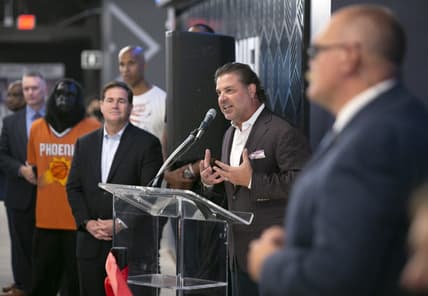Sep 8, 2021; Phoenix, AZ, USA; Phoenix Suns Suns president and CEO Jason Rowley speaks as Arizona Governor Doug Ducey (left) looks on during the grand opening event at the FanDuel Sportsbook at the Footprint Center in Phoenix on September 8, 2021. David Wallace/The Republic via USA TODAY NETWORK