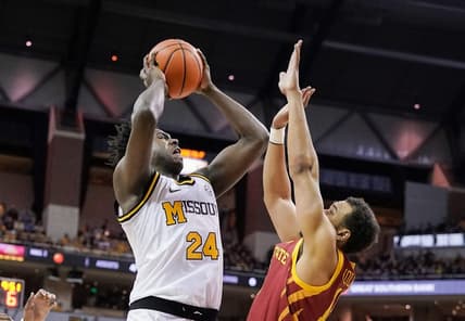 Jan 28, 2023; Columbia, Missouri, USA; Missouri Tigers guard Kobe Brown (24) shoots the ball against Iowa State Cyclones guard Jaren Holmes (13) during the first half at Mizzou Arena. Mandatory Credit: Denny Medley-USA TODAY Sports