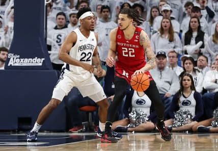 Feb 26, 2023; University Park, Pennsylvania, USA; Rutgers Scarlet Knights guard Caleb McConnell (22) dribbles the ball towards the basket as Penn State Nittany Lions guard Jalen Pickett (22) defends during the first half at Bryce Jordan Center. Mandatory Credit: Matthew OHaren-USA TODAY Sports