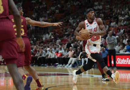 Mar 10, 2023; Miami, Florida, USA;  Miami Heat forward Jimmy Butler (22) heads toward the basket as Cleveland Cavaliers forward Isaac Okoro (35) defends in the first half at Miami-Dade Arena. Mandatory Credit: Jim Rassol-USA TODAY Sports