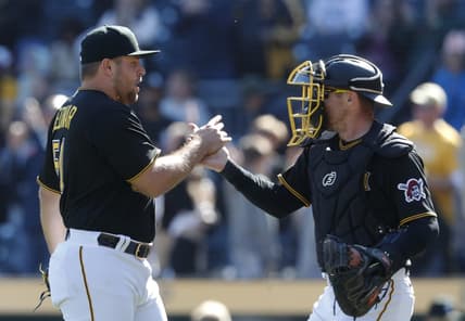 Apr 9, 2023; Pittsburgh, Pennsylvania, USA;  Pittsburgh Pirates relief pitcher David Bednar (51) and catcher Tyler Heineman (54) celebrate after defeating the Chicago White Sox at PNC Park. The Pirates shutout Chicago 1-0. Mandatory Credit: Charles LeClaire-USA TODAY Sports