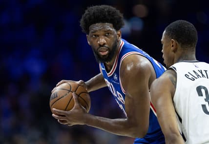 Apr 17, 2023; Philadelphia, Pennsylvania, USA; Philadelphia 76ers center Joel Embiid (21) controls the ball against Brooklyn Nets center Nic Claxton (33) during the third quarter in game two of the 2023 NBA playoffs at Wells Fargo Center. Mandatory Credit: Bill Streicher-USA TODAY Sports