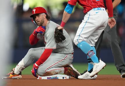 Jul 8, 2023; Miami, Florida, USA;  Philadelphia Phillies designated hitter Bryce Harper (3) takes a moment after hitting a double in the second inning against the Miami Marlins at loanDepot Park. Mandatory Credit: Jim Rassol-USA TODAY Sports