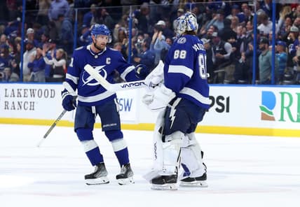 Jan 11, 2024; Tampa, Florida, USA; Tampa Bay Lightning center Steven Stamkos (91) and goaltender Andrei Vasilevskiy (88) celebrate after they beat the New Jersey Devils during overtime at Amalie Arena. Mandatory Credit: Kim Klement Neitzel-USA TODAY Sports