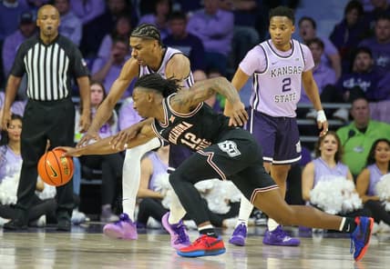 Jan 20, 2024; Manhattan, Kansas, USA; Oklahoma State Cowboys guard Javon Small (12) and Kansas State Wildcats forward David N'Guessan (1) go after a loose ball during the first half at Bramlage Coliseum. Mandatory Credit: Scott Sewell-USA TODAY Sports