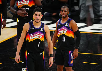 Jun 9, 2021; Phoenix, Arizona, USA; Phoenix Suns guard Chris Paul (3) and Devin Booker (1) against the Denver Nuggets during game two in the second round of the 2021 NBA Playoffs at Phoenix Suns Arena. Mandatory Credit: Mark J. Rebilas-USA TODAY Sports