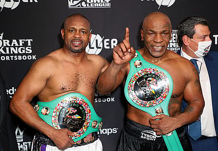Nov 28, 2020; Los Angeles, CA, USA;  Mike Tyson and Roy Jones, Jr. pose with their belts after a split draw during a heavyweight exhibition boxing bout for the WBC Frontline Belt at the Staples Center.  Mandatory Credit: Joe Scarnici/Handout Photo via USA TODAY Sports