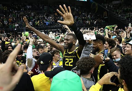 Oregon's Franck Kepnang celebrates with fans as they storm the court after the win over UCLA Feb. 24, 2022.

Eug 022422 Uombb Ucla 05