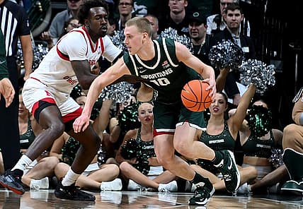 Jan 3, 2023; East Lansing, Michigan, USA;  Michigan State Spartans forward Joey Hauser (10) drives past Nebraska Cornhuskers forward Juwan Gary (4) in the first half at Jack Breslin Student Events Center. Mandatory Credit: Dale Young-USA TODAY Sports