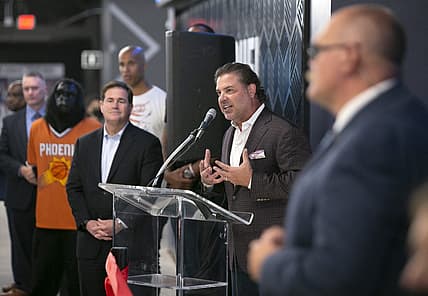 Sep 8, 2021; Phoenix, AZ, USA; Phoenix Suns Suns president and CEO Jason Rowley speaks as Arizona Governor Doug Ducey (left) looks on during the grand opening event at the FanDuel Sportsbook at the Footprint Center in Phoenix on September 8, 2021. David Wallace/The Republic via USA TODAY NETWORK