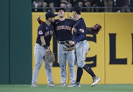 Jul 17, 2023; Pittsburgh, Pennsylvania, USA;  Cleveland Guardians left fielder Steven Kwan (left) and center fielder Myles Straw (middle) and right fielder David Fry (right) celebrate in the outfield after defeating the Pittsburgh Pirates at PNC Park. The Guardians shutout the Pirates 11-0. Mandatory Credit: Charles LeClaire-USA TODAY Sports