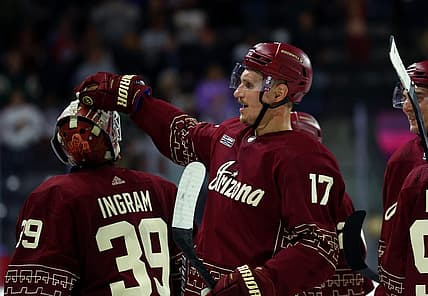 Nov 30, 2023; Tempe, Arizona, USA; Arizona Coyotes center Nick Bjugstad (17) celebrates with goalie Connor Ingram (39) after scoring the winning goal against the Colorado Avalanche in overtime at Mullett Arena. Mandatory Credit: Mark J. Rebilas-USA TODAY Sports