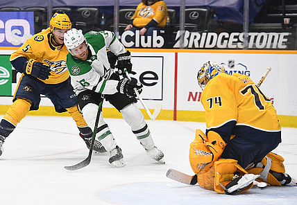 Apr 11, 2021; Nashville, Tennessee, USA; Dallas Stars center Joe Pavelski (16) has a shot blocked by Nashville Predators goaltender Juuse Saros (74) during the second period at Bridgestone Arena. Mandatory Credit: Christopher Hanewinckel-USA TODAY Sports