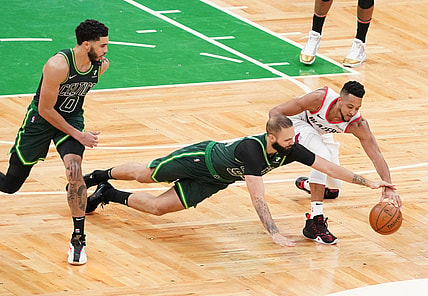 May 2, 2021; Boston, Massachusetts, USA; Boston Celtics guard Evan Fournier (94) steals the ball from Portland Trail Blazers guard CJ McCollum (3) in the fourth quarter at TD Garden. Mandatory Credit: David Butler II-USA TODAY Sports