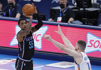May 4, 2021; Oklahoma City, Oklahoma, USA; Sacramento Kings guard Delon Wright (55) shoots as Oklahoma City Thunder guard Svi Mykhailiuk (14) defends during the third quarter at Chesapeake Energy Arena. Mandatory Credit: Alonzo Adams-USA TODAY Sports