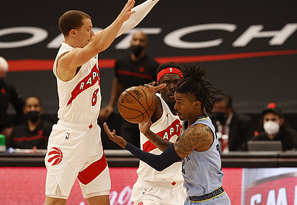 May 8, 2021; Tampa, Florida, USA;  Toronto Raptors forward Pascal Siakam (43) and Toronto Raptors guard Malachi Flynn (8) cause Memphis Grizzlies guard Ja Morant (12) to turn the ball over during the first half at Amalie Arena. Mandatory Credit: Kim Klement-USA TODAY Sports