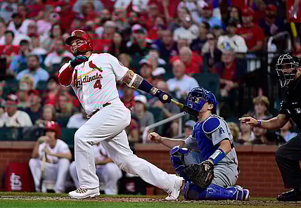 Sep 8, 2021; St. Louis, Missouri, USA;  St. Louis Cardinals catcher Yadier Molina (4) hits a two run home run during the first inning against the Los Angeles Dodgers at Busch Stadium. Mandatory Credit: Jeff Curry-USA TODAY Sports