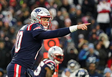 Nov 28, 2021; Foxborough, Massachusetts, USA; New England Patriots quarterback Mac Jones (10) on the line of scrimmage against the Tennessee Titans in the second half at Gillette Stadium. Mandatory Credit: David Butler II-USA TODAY Sports