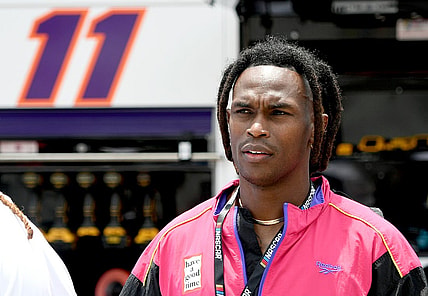 Jul 10, 2022; Hampton, Georgia, USA; Former Falcons receiver Julio Jones stands on the grid prior to the Quaker State 400 at Atlanta Motor Speedway. Mandatory Credit: Adam Hagy-USA TODAY Sports