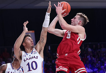 Nov 24, 2022; Paradise Island, BAHAMAS; Wisconsin Badgers forward Tyler Wahl (5) shoots over Kansas Jayhawks forward Jalen Wilson (10) during the second half at Imperial Arena. Mandatory Credit: Kevin Jairaj-USA TODAY Sports