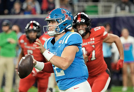 Dec 28, 2022; Houston, Texas, USA; Mississippi Rebels quarterback Jaxson Dart (2) scrambles from Texas Tech Red Raiders in the second half in the 2022 Texas Bowl at NRG Stadium. Mandatory Credit: Thomas Shea-USA TODAY Sports