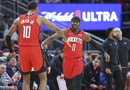 Feb 12, 2024; Houston, Texas, USA; Houston Rockets guard Aaron Holiday (0) celebrates with forward Jabari Smith Jr. (10) after a play during the fourth quarter against the New York Knicks at Toyota Center. Mandatory Credit: Troy Taormina-USA TODAY Sports