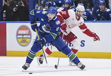 Former Golden Knights trade target and Vancouver Canucks winger Drew O'Connor skates with the puck