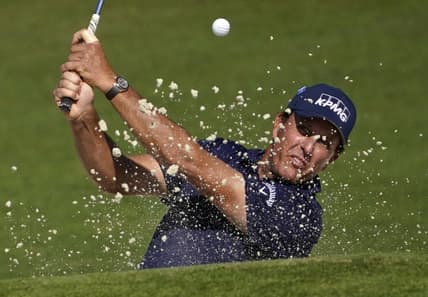 Nov 14, 2020; Augusta, Georgia, USA; Phil Mickelson plays a shot from a bunker on the second hole during the third round of The Masters golf tournament at Augusta National GC. Mandatory Credit: Michael Madrid-USA TODAY Sports