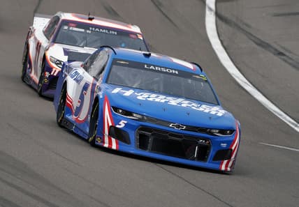 Mar 7, 2021; Las Vegas, Nevada, USA; NASCAR Cup Series driver Kyle Larson (5) leads driver Denny Hamlin (11) during the Pennzoil 400 at Las Vegas Motor Speedway.  Mandatory Credit: Gary A. Vasquez-USA TODAY Sports