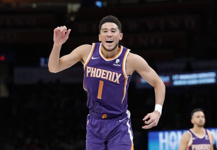 Feb 24, 2022; Oklahoma City, Oklahoma, USA; Phoenix Suns guard Devin Booker (1) after scoring against the Oklahoma City Thunder during the second half at Paycom Center. Phoenix won 124-104. Mandatory Credit: Alonzo Adams-USA TODAY Sports